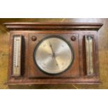 An Edwardian oak ACMA wall mounting weather station, barometer, thermometer, storm glass, 33cm x