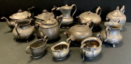 A 19th century pewter three piece tea set, other teapot, Arts & Crafts water jug, cream jug