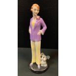 An Art Deco Goebel figure, of a young lady and a dog, 24cm high, impressed monogram, model no. FF10,