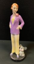 An Art Deco Goebel figure, of a young lady and a dog, 24cm high, impressed monogram, model no. FF10,