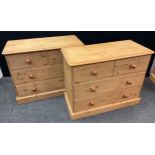 A pair of pine four drawer chests, each with rounded oversailing tops, two short over three long