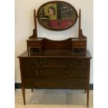 An Edwardian inlaid mahogany dressing table, inlaid marquetry detailing, tapered legs, on caster