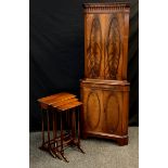 A mid 20th century mahogany corner cupboard; three interior shelves with brass rail detail, vanity