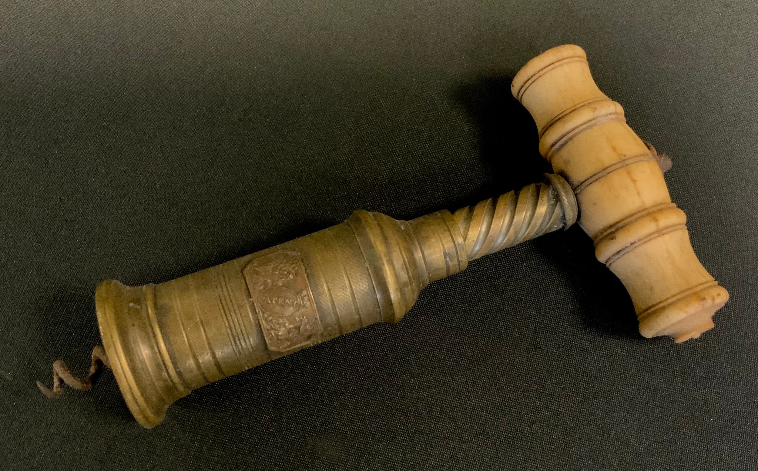A 19th century brass patent corkscrew, bone handle, 17cm long