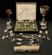 A set of nine silver coloured metal tea spoons, elephant and sterling marks; others unmarked;