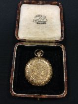 An 18ct gold hunter cased pocket watch, floral decoration throughout, white enamel dial, Roman