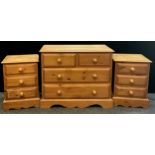 A mid 20th century pine chest of drawers; over-sailing top, pair of drawers to frieze over two