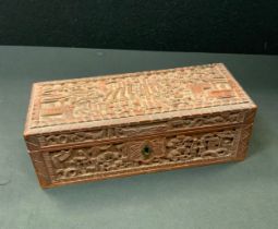 A 19th century Chinese sandalwood casket, carved in the typical Cantonese manner with figures and