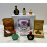 Three empty bottles of perfume from Jean Paton including “1000”; three Lanvin perfume bottles .
