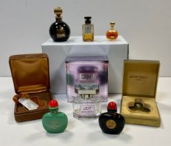 Three empty bottles of perfume from Jean Paton including “1000”; three Lanvin perfume bottles .
