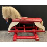 A mid century painted wooden Rocking horse, 86.5cm high x 117cm long.