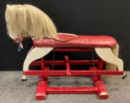 A mid century painted wooden Rocking horse, 86.5cm high x 117cm long.