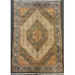 A Persian Moud rug, hand-knotted, hexagon-shaped medallion, in subdued tones of blue, red, and