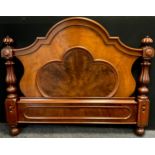 A Victorian mahogany headboard, shaped arched top, turned and carved columns, 125cm high, 150cm wide