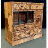 A Japanese parquetry inlaid specimen wood table top Tansu cabinet, with an arrangement of five