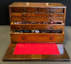 A Peckhams's oak Engineers/Watch makers tool box containing a large quantity of assorted watch