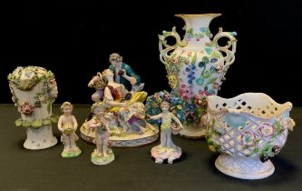 A Continental figure group of man, lady and dog, 18cm long, Derby style putti, 18cm high; etc (6)