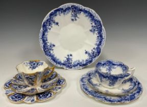 Two Wileman and Company tea cup trios; pattern 'Rose', no. 6924, c.1896; pattern 'Fern' no. 9122,