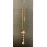 A peridot pink topaz and seed pearl pendant necklace, oval pink topaz quartered with seed pearls,