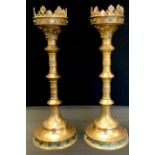 A pair of 17th century style brass pricket candlesticks, (lacking point), 49cm high, 18cm
