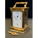 A Eurotime brass carriage clock, white dial, Roman and Arabic numerals, 12 o'clock subsidiary