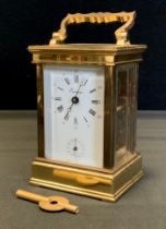 A Eurotime brass carriage clock, white dial, Roman and Arabic numerals, 12 o'clock subsidiary