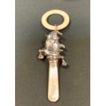 A silver Mr Punch teething rattle, mop handle, Chester marks