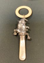 A silver Mr Punch teething rattle, mop handle, Chester marks