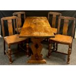 An early 20th century oak trestle table, 71cm high x 166.5cm x 61.5cm; and a set of footprints oak