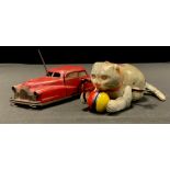 A French Joustra No.2002 tinplate clockwork Miracle car, with red body, printed detail, fitted