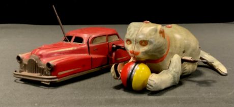 A French Joustra No.2002 tinplate clockwork Miracle car, with red body, printed detail, fitted