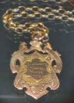 A 9ct gold shield medal pendant necklace, Slaithwaite Prize 1909, 20.6g gross