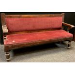 An early 20th century pine railway station Waiting-room type bench, upholstered back and seat,