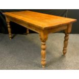 A pine plank-top table, rounded rectangular top, turned legs, 78cm high x 173cm wide x 77cm, early