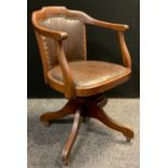 A mid 20th century beech office desk chair, tilt and revolve seat.