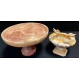 A polished onyx pedestal comport, pink, green and cream patina, 25.5cm diameter, white marble