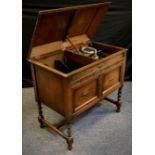 A 1920’s Gilbert & Co. of Sheffield oak cased gramophone, hinged lift-up top, with gramophone and