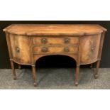 A George III style inlaid mahogany breakfront sideboard, two central drawers, flanked by bowed