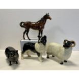 A Beswick model, of an Aberdeen Angus bull, gold printed mark; another Swish Tail Horse, brown