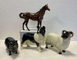 A Beswick model, of an Aberdeen Angus bull, gold printed mark; another Swish Tail Horse, brown