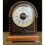 An Edwardian/early 20th century oak cased Bulle patent early electric domed mantel clock