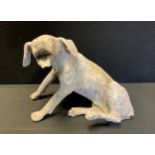 Garden statuary - a cast iron hound, of good aged patination, 35cm high x 45cm long.