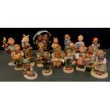 A collection of seventeen Goebel/Hummel figures inc Girls with Chicks, Little Hiker, Toothache,