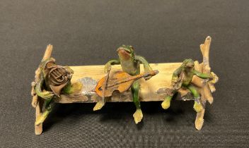 A Bergman style Viennese cold painted metal figure group, as three frog musicians, playing French