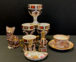 Royal Crown Derby - 1128 pattern, including; three goblets, twin handled loving cup, table bell, cat