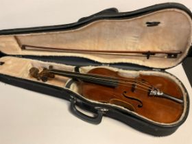 A full size, 4/4, violin, cased with bow en-suite, the violin having a well figured two-piece