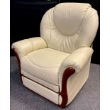 A cream leather electric recliner armchair.