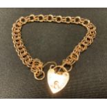 A fancy link 9ct gold bracelet, padlock clasp, 16cm long, 8.5g