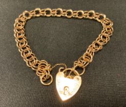 A fancy link 9ct gold bracelet, padlock clasp, 16cm long, 8.5g