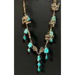 A modernist 9ct gold and turquoise fringe necklace, of eight free form wire bar panels, divided by